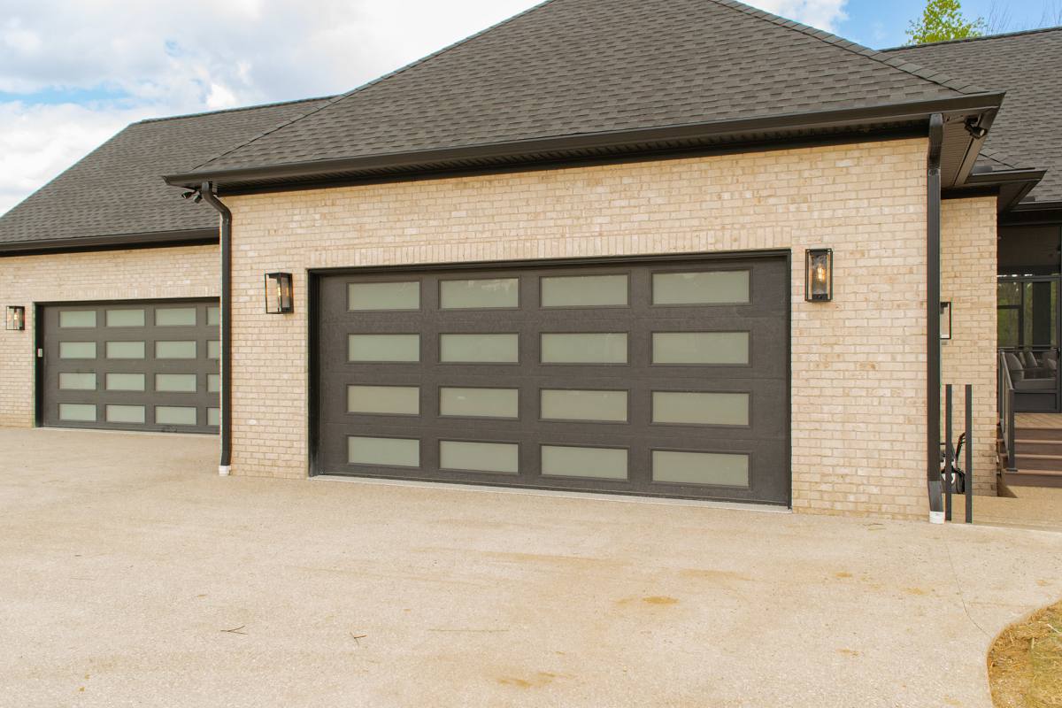 modern steel garage doors on craftsman home